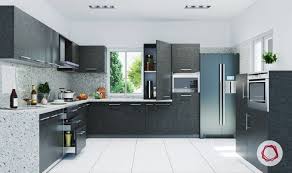 An airy kitchen with dove grey cabinets and a kitchen island, white stone countertops, wicker stools and frame chandeliers. 12 Grey Kitchens That Are Drop Dead Gorgeous Modern Kitchen Cabinet Design Grey Kitchen Designs Kitchen Design Trends
