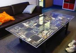 Each table is crafted from solid wood and features understated moldings, tapered legs and three drawers to house your remote, coasters and magazines. Innovative Coffee Table Design Uses Pc Circuit Boards
