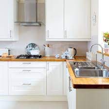 Whatever style you're looking to achieve, with our high quality range of kitchen worktops, you'll find the perfect fit for your home. White Modern Shaker Style Kitchen With Wooden Worktops Ideal Home Shaker Style Kitchens White Modern Kitchen White Kitchen Wooden Worktops