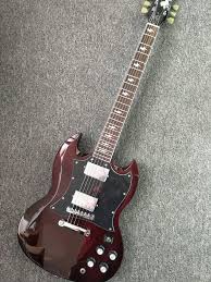 Gibson angus young sg reflects that modification. High Quality Angus Young Sg Guitars In Aged Cherry China Oem Hardware Chrome Custom Body Electric Guitar Available Yesterday Sg Guitar Guitar Epiphone Guitars