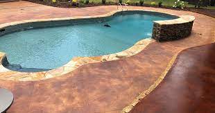 Clear the pool deck of all chairs, toys, planters, and anything else that may present a trip hazard while the pool is empty. Pool Deck In Amory Custom Concrete Creations