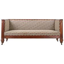 Exceptional english made scroll arm regency red leather chesterfield sofa settee. 19th Century Empire Box Form Antique Sofa Settee With Barrel Column Arms 1stdibs Com Antique Sofa Settee Sofa Carved Sofa