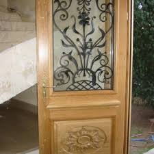 30038951 529,00 € ttc / pièce sur commande. Portes D Entree Chene Massif Avec Grille En Fer Forge Cie Des Ferronniers D Art