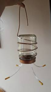 Make Your Own Homemade Hummingbird Feeders Building With Recyled And Re Purposed Bottle Homemade Hummingbird Feeder Diy Hummingbird Feeder Humming Bird Feeders