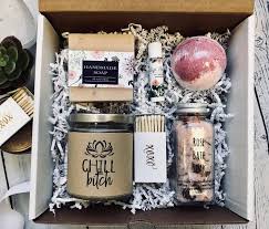A bounteous corporate gift box filled to the brim with sweet treats, including chocolate covered pretzel twists, dark chocolate and pecan toffee, and rosemary shortbread cookies. 50 Unique Gift Basket Ideas That Anyone Will Love In 2020