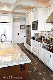 Love this dark wood floors clean white shaker style cabinets. Chef S Dream White Kitchen With Marble And Granite Kylie M Interiors