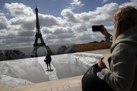 An architectural feat for the time, the eiffel tower was the first monument in the world. Tourist Hot Spot In Paris Optical Illusion Next To Eiffel Tower Daily Sabah
