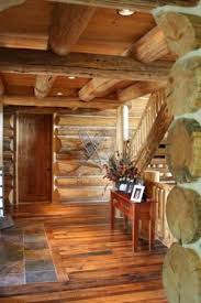 Slate Tiles In Entry Butted Up Against The Darker Hardwood Floors Makes It Feel Warmer And Cozier I Thin Log Cabin Lighting Log Cabin Living Log Cabin Decor