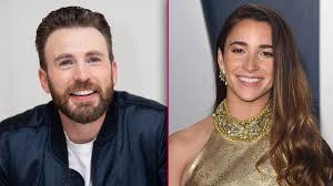 Antony rafiq khan (born october 10, 1982) is an american businessman and sports executive known for his involvement in american football, professional wrestling, and soccer. Chris Evans Gets Cozy With Olympian Aly Raisman S Puppy