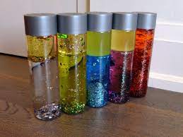 The glitter sensory bottle ingredients: Diy Sensory Bottles Some Food Colouring In Water Sparkles And Finish Off With Regular Cooking Oil Sensory Bottles Bottle Social Skills For Kids