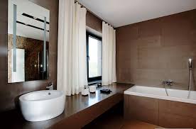 A neutral color palette keeps the focus on the room's charming accessories. Modern White And Brown Bathroom Design My Home Deco Mag