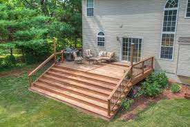 This Deck Features A Wide Staircase Creating An Open Feeling To This Hardwood Deck Deck Designs Backyard Patio Deck Designs Hardwood Decking
