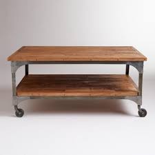 Wood base/legs in dark wenge finish. World Market Aiden Coffee Table Knock Off Coffee Table With Wheels Coffee Table With Casters Round Coffee Table