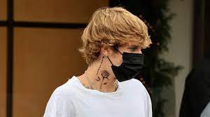 This is bieber's korean mask tattoo. Justin Bieber Got A New Neck Tattoo His Mom Does Not Approve Teen Vogue