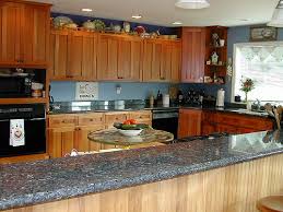 You can choose darker shades for your kitchen or a light one. Blue Pearl Granite Countertop Cherry Cabinet Kitchen Bragg Constructionbragg Construction