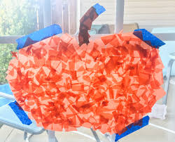 You can cut multiple sheets at the same time by folding them together. Easy Tissue Paper Pumpkin Craft Happy Toddler Club