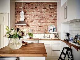 This difference is where the style gets its nicknames of 'brick pattern' and 'running bond'. An Exposed Brick Wall And White Subway Tiles It Shouldn T Work But It So Does In This Small But Perfec Brick Wall Kitchen Exposed Brick Kitchen Brick Kitchen