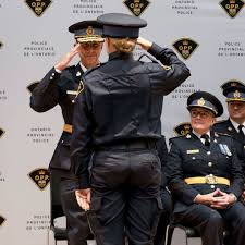 police officer getting congratulated