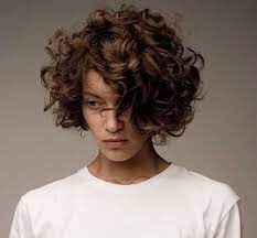For an original approach, start by parting your hair half up half down. Goal Grow Out My Pixie Into This Beautiful Curly Bob Curly Hair Styles Curly Girl Hairstyles Short Curly Haircuts