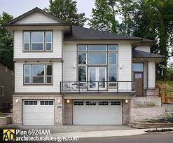 Great for families or empty nesters with guests. Plan 6924am For A Front Sloping Lot Sloping Lot House Plan Narrow Lot House Plans Architectural Design House Plans