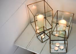 This hurricane candle holder would be a wonderful addition to any spring decor. Large Antique Brass And Glass Hurricane Candle Holder Lantern By Nkuku