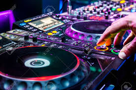 dj mixes the track in the nightclub at party