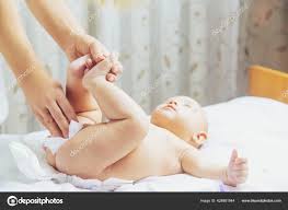 Mother Changes Baby S Diaper Selective Focus People Stock Photo By C Yana Komisarenko Yandex Ru 428881944