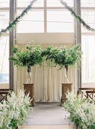 Greens Turned A City Wedding Into A Garden Oasis Wedding Ceremony Flowers Ceremony Decorations Ceremony Flowers