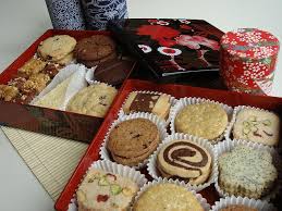 Assorted christmas cookies with powdered sugar on the dark background, top view. Assorted Christmas Cookies In Japanese Multi Tiered Box Christmas Baking Christmas Cookies Gift Holiday Cookies Christmas