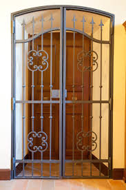 Castle doors & more carries all kinds of custom exterior doors of all types including wood, fiberglass,steel & iron. Image Result For Metal Glass Security Doors That Go Over A Solid Door Iron Security Doors Wrought Iron Front Door Iron Front Door