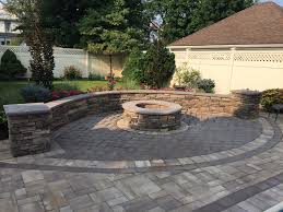 Paved Patio With Stone Veneer Sitting Wall Circular Fire Pit As Well As Grey Herringbone Pavers All Desig Fire Pit Landscaping Fire Pit Decor Small Fire Pit