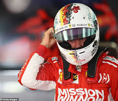 Seb and his chrome helmet. Sebastian Vettel Holding No Grudges As Ferrari Tyre Gamble Backfires Daily Mail Online