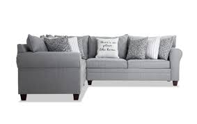 One storage console with 2 cup holders; Laurel Gray 3 Piece Left Arm Facing Sectional Bob S Discount Furniture
