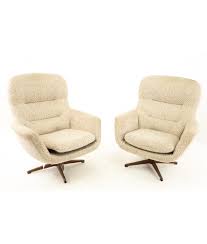 This set of a mid century swivel chair and ottoman was designed and manufactured in italy, during the 1950s. Mid Century Upholstered Swivel Lounge Chairs With One Ottoman In Tan Pair