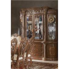 The dining room group features a rectangular dining table supported by two very detailed metal pedestals, and lushly upholstered seating. 56005 25 Aico Furniture Torino Dining Room China