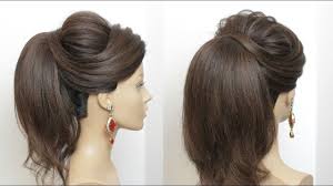 The hair is also going into a low ponytail, but a loop of hair is done up, and secured with a rubber band. New High Ponytail Hairstyle With Puff For Long Hair Youtube High Ponytail Hairstyles Long Hair Styles Hair Styles