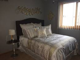 A stunning metallic headboard is a focal point in this regal bedroom, but warm gold accents on the mirror and pillows add a luxe touch. Design Collection Marvelous Gold Silver Bedroom Ideas 50 New Inspiration