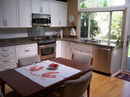 Kraftmaid Lyndale Dove White Shaker Cabinets And Granite Counters White Shaker Cabinets Kitchen Remodel Shaker Cabinets
