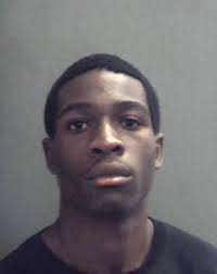 Arrest documents say he walked into the dorm behind her while the door was  still open.