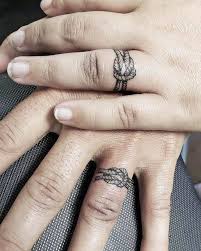 Stylish wedding ring imitating tattoos with a monogram of your partner. 66 Unique Small Finger Tattoos With Meaning Our Mindful Life