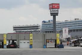 He did something wrong or his car isn't fit to be on the track. Garage 1 With Speedway Condos In The Background Picture Of Charlotte Motor Speedway Concord Tripadvisor