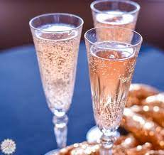 Ginger ale, hawaiian punch, lemon juice, sugar, pineapple juice, ice served in a other glass. How To Make Faux Pink Champagne An Alli Event