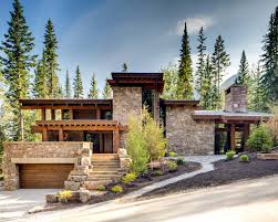 This rustic home design features a creative blend of rustic and craftsman details making it the perfect lake or mountain getaway. Rugged Mountain Ski Retreat In The Canadian Rockies House Designs Exterior House Exterior Hillside House