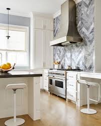 Maybe you would like to learn more about one of these? White Kitchen With Gray Marble Herringbone Tile Backsplash Contemporary Kitchen