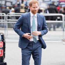 Prince Harry in Paul Smith with Meghan Markle in March 2020