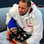 Shivering migrant baby plucked from