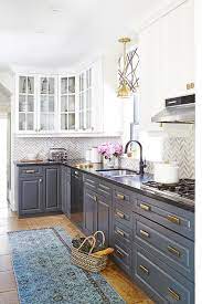 Need modern cabinets for your kitchen remodel? White Upper Cabinets And Gray Lower Cabinets With Brass Hardware Contemporary Kitchen Kitchen Renovation Kitchen Redo New Kitchen Cabinets