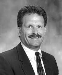 Seton-La Salle volunteer photographer hanging up camera