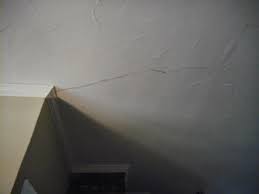 Sand away any loose paint and drywall. Drywall Ceiling Crack Emanating From Near The Outside Corner Of Two Interior Drywall Walls Home Improvement Stack Exchange