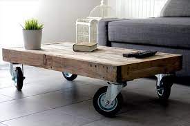 Sand the whole pallet to give new and glowing look with some orbital or palm sander and stain it with some brush and have tremendous dark brown look for your chic coffee table model. Wooden Pallet Coffee Table On Wheels Wood Table Diy Pallet Projects Furniture Coffee Table Wood